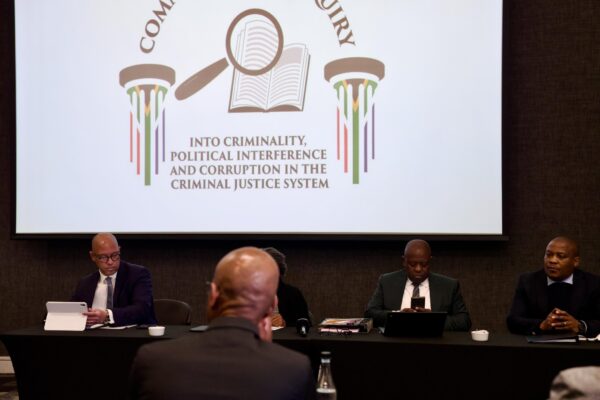 Madlagadla commission of inquiry officials in a meeting.